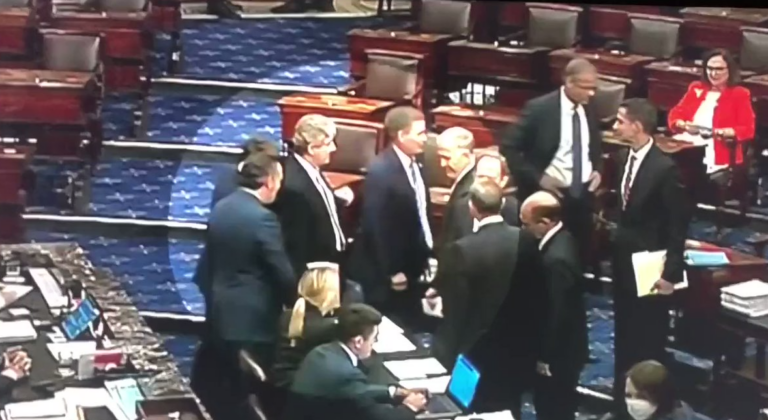 Video of Ted Cruz fist bumping fellow Republicans after blocking the PACT Act